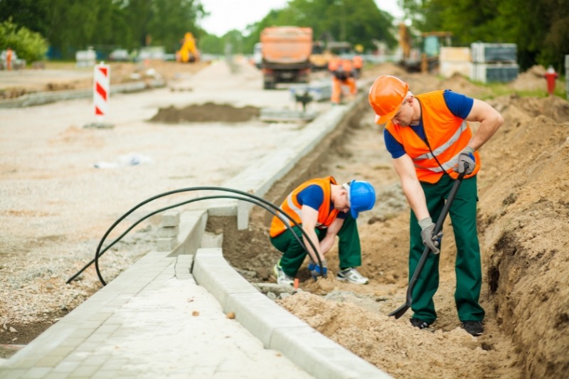 An image of constructions workers renovating the road under civil construction work