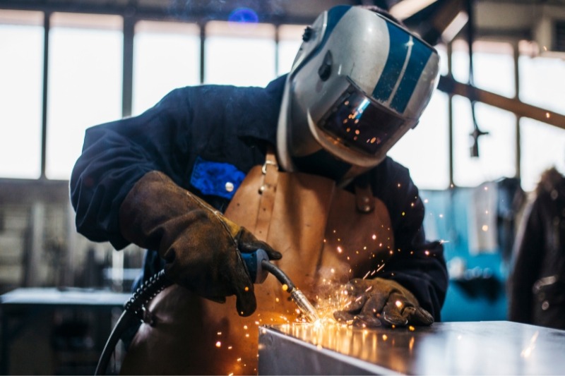 An image of a construction worker doing welding